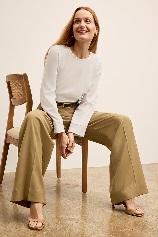 front image of a woman wearing the jules top in eggshell | Exclude