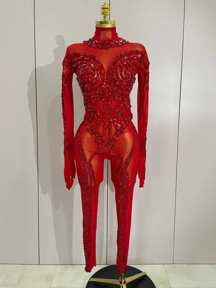 Luxury sheer rhinestone mesh jumpsuit with glittering diamonds and sequins for festival or stage wear.