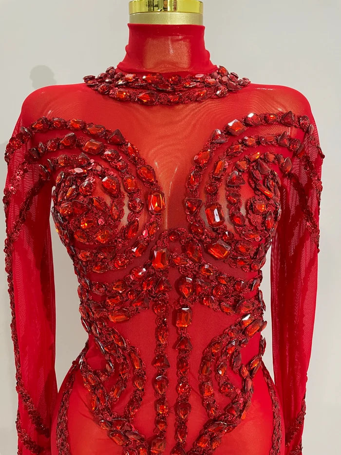 Luxury sheer rhinestone mesh jumpsuit with glittering diamonds and sequins for festival or stage wear.