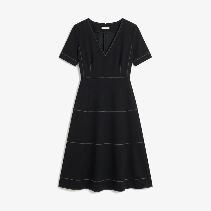 Black dress with white stitching on a white background