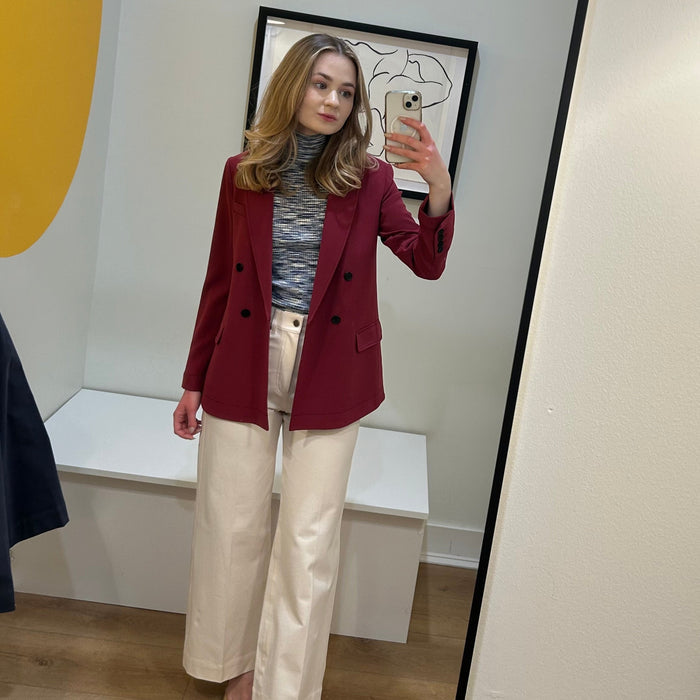 image of a woman wearing the koa turtleneck