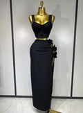 Black and red floral bandage two piece outfit with fitted top and skirt.