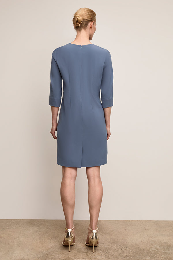 back image of a woman wearing Lancia  Dress Dusty Blue | Exclude | Grid Hover