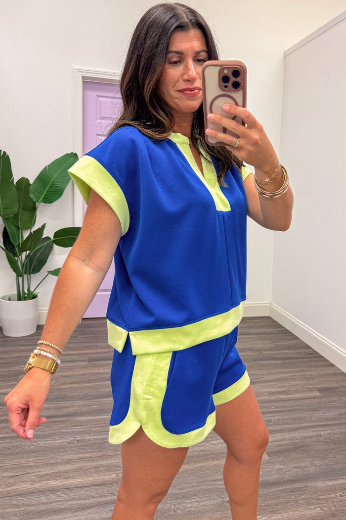 royal blue with lime colorblock trim short capped sleeve v neckline knit top