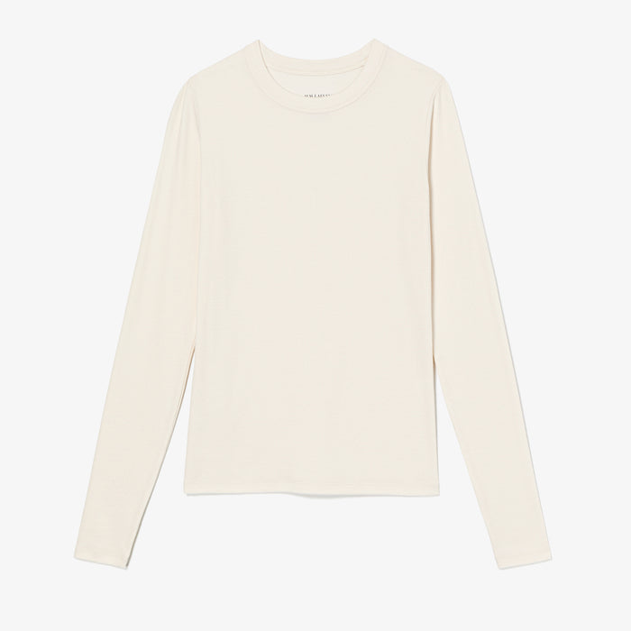 White long-sleeve shirt on a light gray background