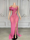 Elegant formal prom dress with sparkling rhinestones and a tasteful high split. Maya luxury evening gown.