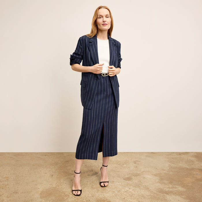 Front image of a woman wearing Meghan1.0Skirt_StripedPortoWeave_Navy-Ivory