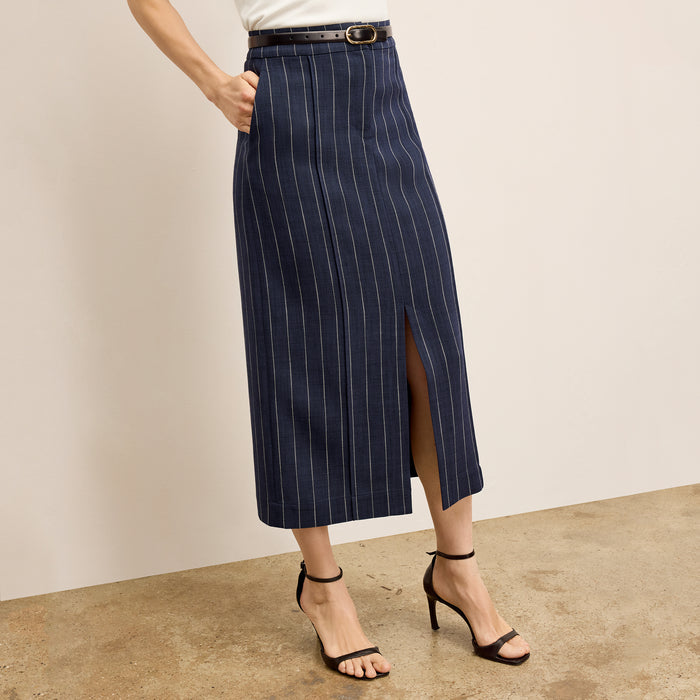 Front image of a woman wearing Meghan1.0Skirt_StripedPortoWeave_Navy-Ivory