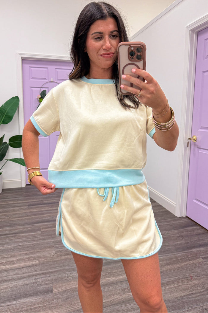 butter yellow with light blue trim details short sleeve relaxed silhouette knit top