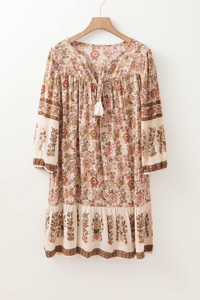 Mini-robe ample à col en V avec cordon de serrage *