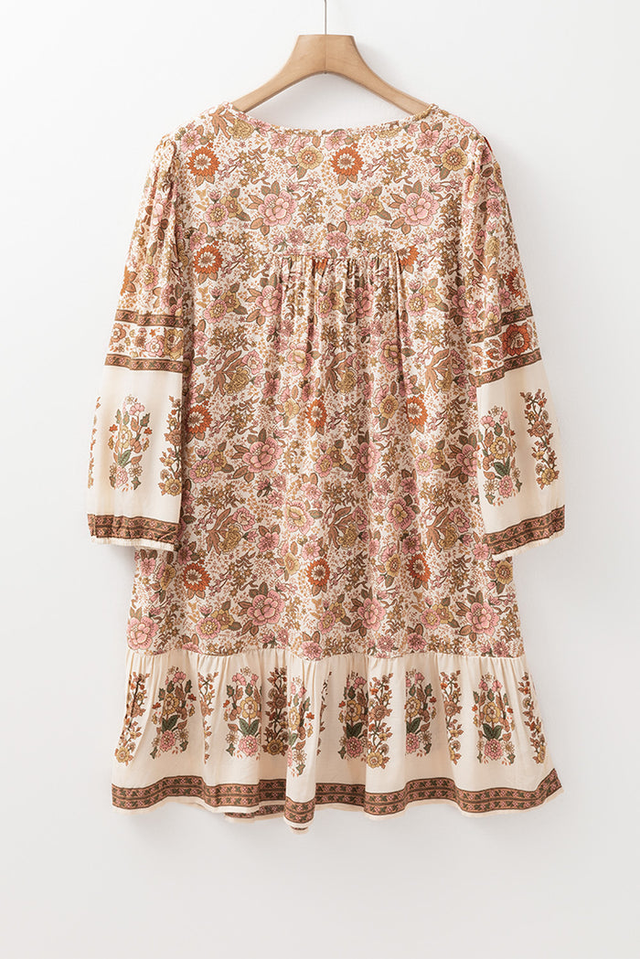 Mini-robe ample à col en V avec cordon de serrage *