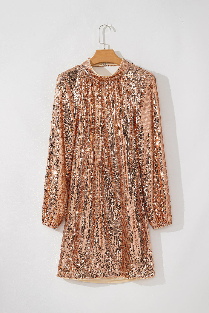 Mini-robe dorée à paillettes et manches longues, dos découpé