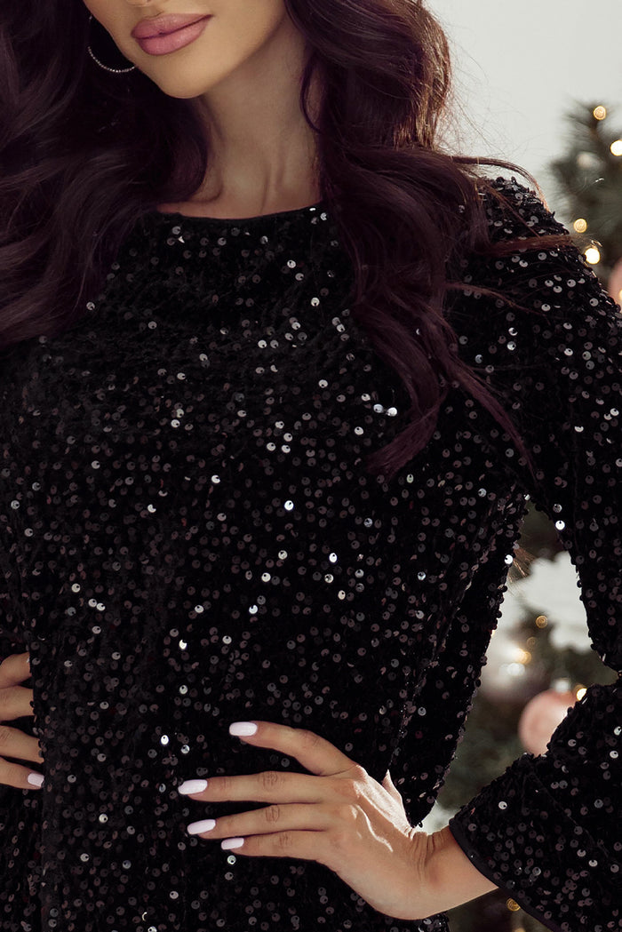 Mini-robe noire à paillettes et manches longues avec nœud découpé dans le dos