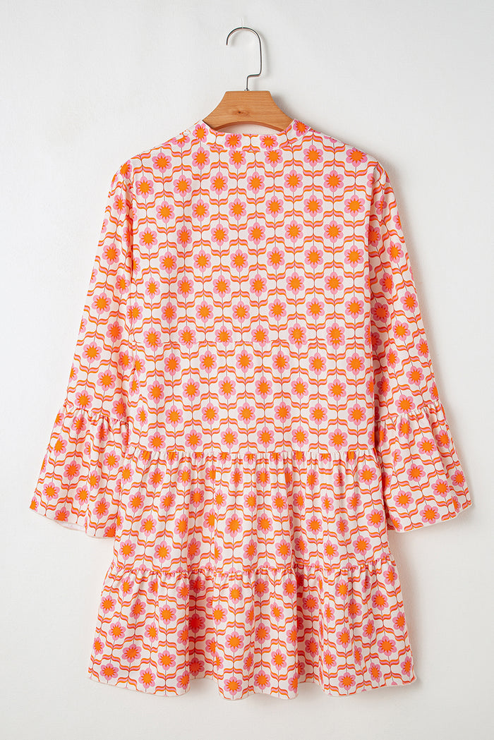 Mini-robe orange à imprimé floral et manches à volants *