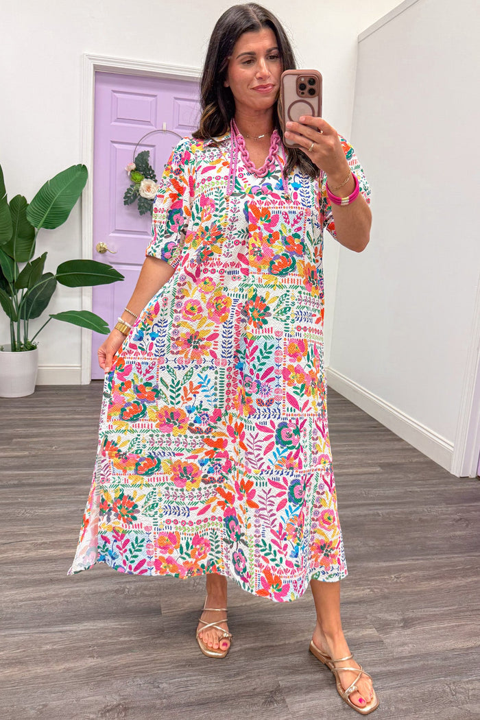 bright multi-colored floral print short sleeve v neckline relaxed fit midi dress