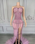 Nylah strapless rhinestone prom dress with high slit and see-through mesh design.