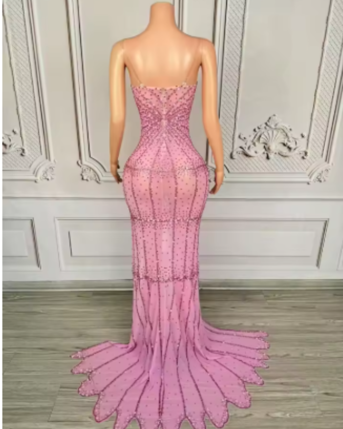Nylah strapless rhinestone prom dress with high slit and see-through mesh design.