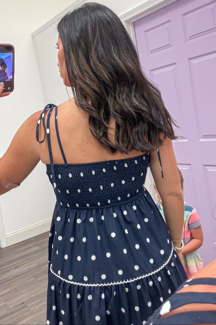 navy with white polka dot print sleeveless smocked back tiered midi dress