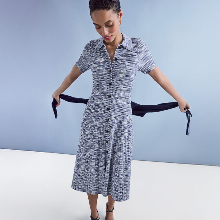 Woman wearing a blue patterned dress