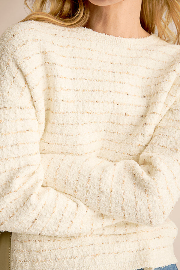 Close-up of a textured white sweater | Exclude | Grid Hover