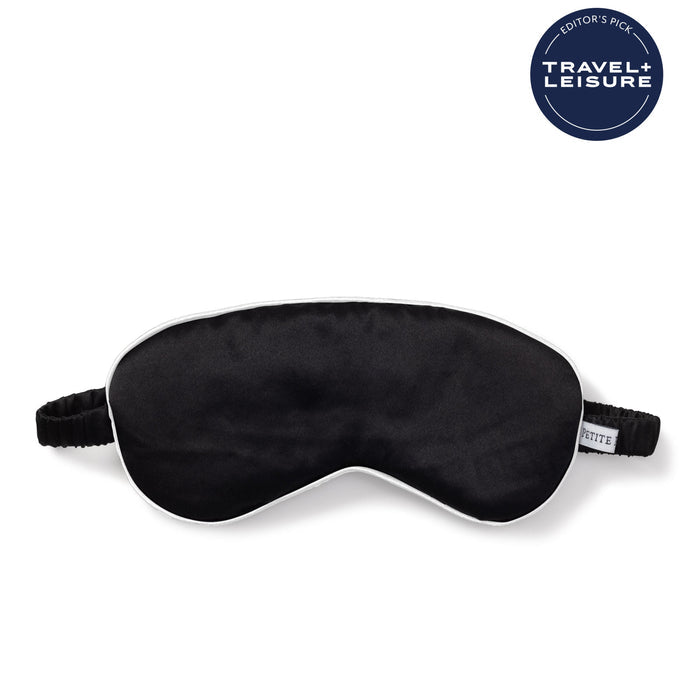 Black sleep mask on a white background with 'Travel + Leisure' logo. | Lead