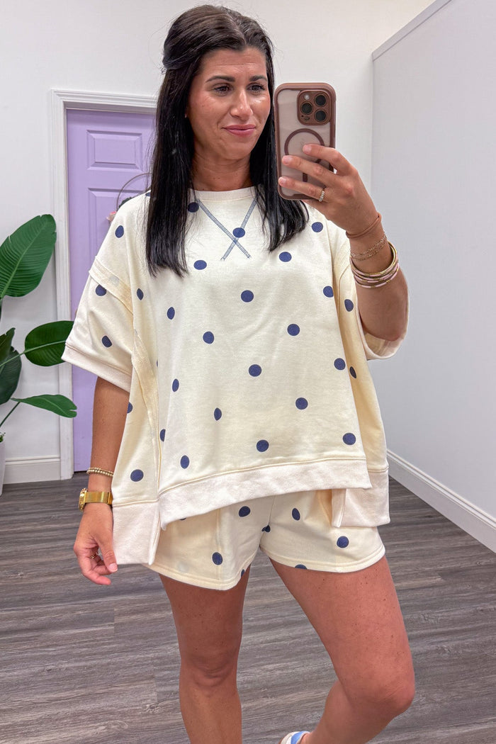 ivory with navy polka dot print crew neckline terry knit dolman top