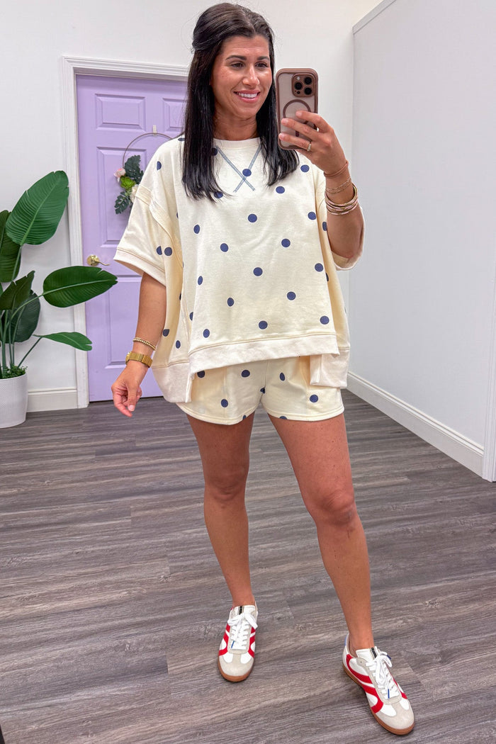 ivory with navy polka dot print terry knit dolman top asymmetrical bottom hem