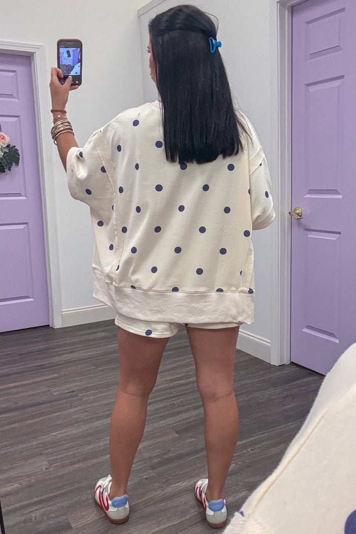 ivory with navy polka dot print terry knit dolman top with reverse seam details