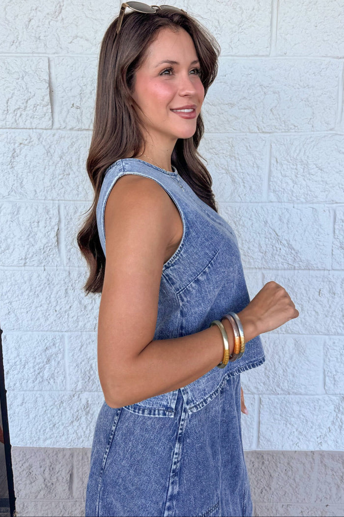washed blue denim sleeveless crew neckline semi-cropped top with side slits at hem