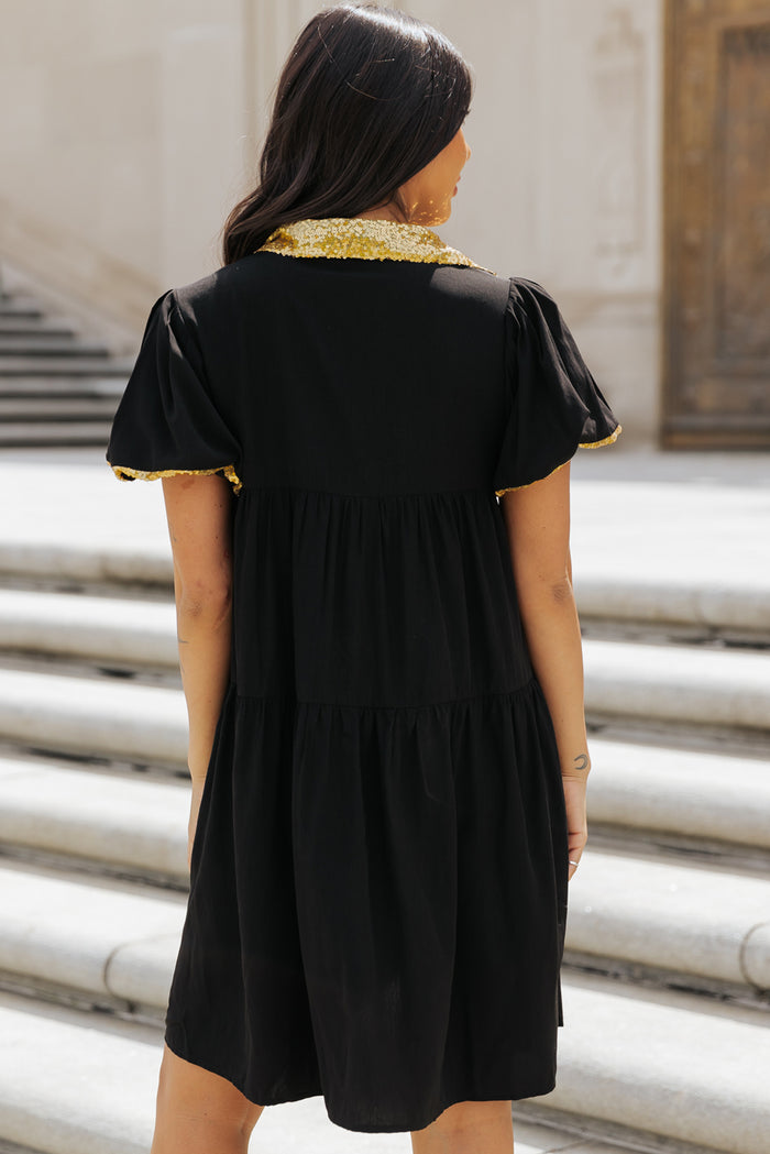 Robe chemise noire à manches bulles et bordure en sequins pour le jour du match