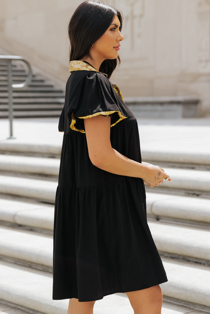 Robe chemise noire à manches bulles et bordure en sequins pour le jour du match