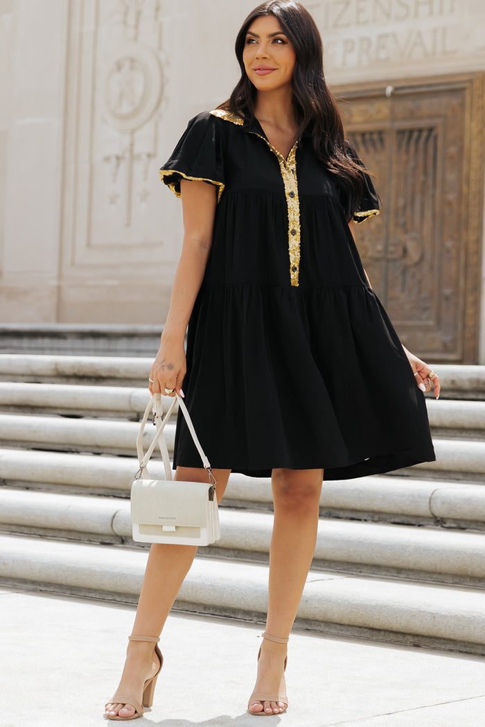 Robe chemise noire à manches bulles et bordure en sequins pour le jour du match