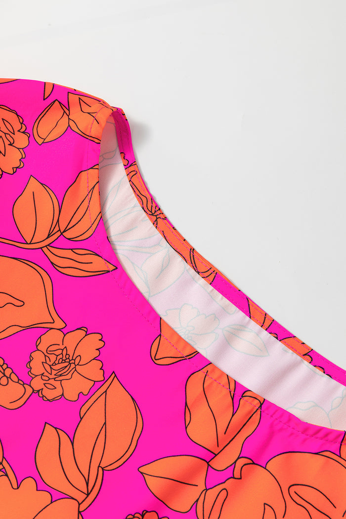 Robe fleurie rose volumineuse à manches volantées *