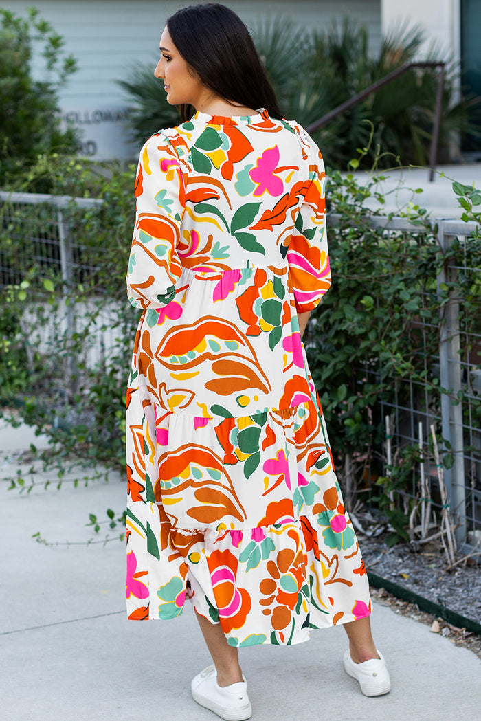 Robe longue orange à imprimé floral fendue à col en V et à plusieurs niveaux