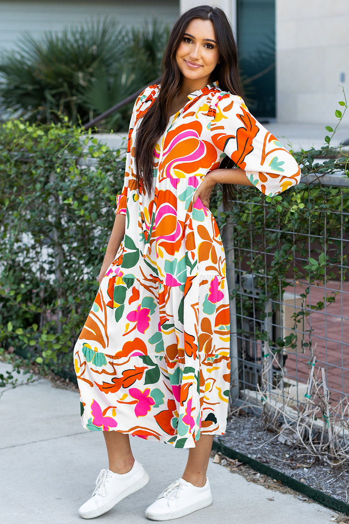 Robe longue orange à imprimé floral fendue à col en V et à plusieurs niveaux