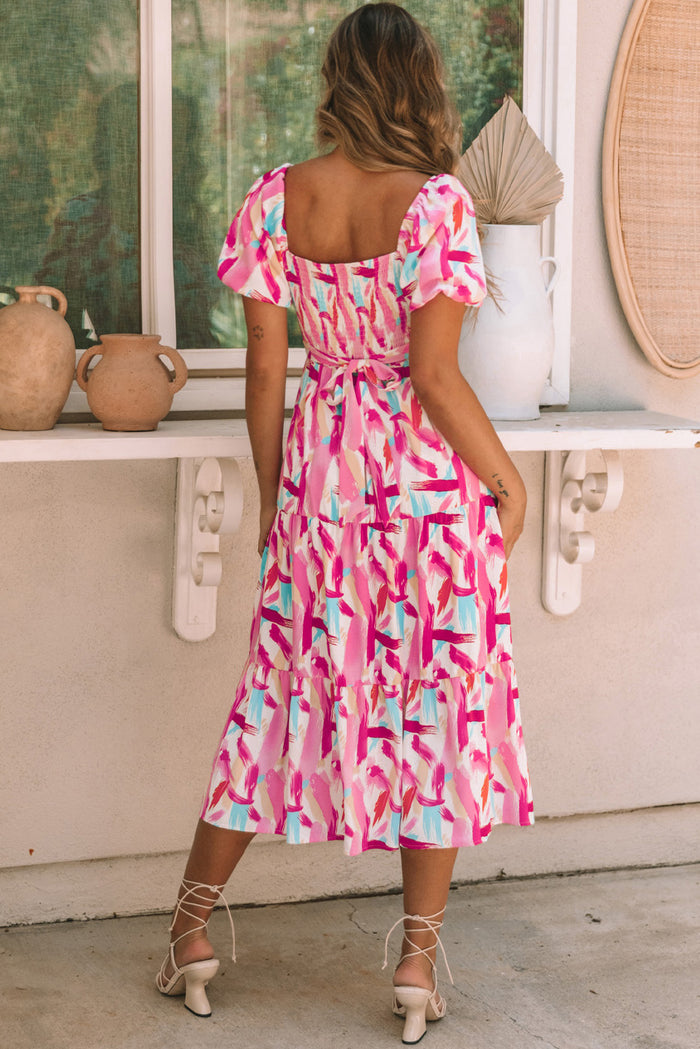 Robe rose smockée à volants et imprimé coup de pinceau