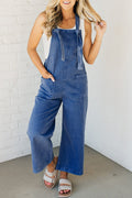 Salopette en denim bleu de Prusse avec bretelles nouées et poche plaquée, jambe large