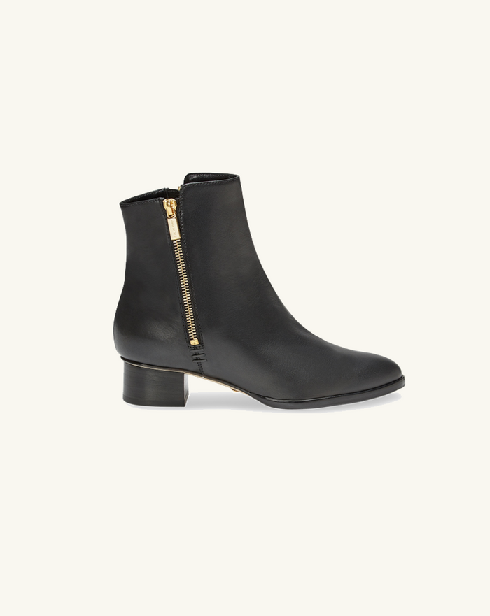 Black ankle boot with a gold zipper on a white background | ALT GRID | Exclude