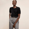 Front image of a woman wearing the Sina top in black | Lead