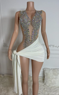 White birthday dress with silver sequin detailing and an elegant fitted silhouette.
