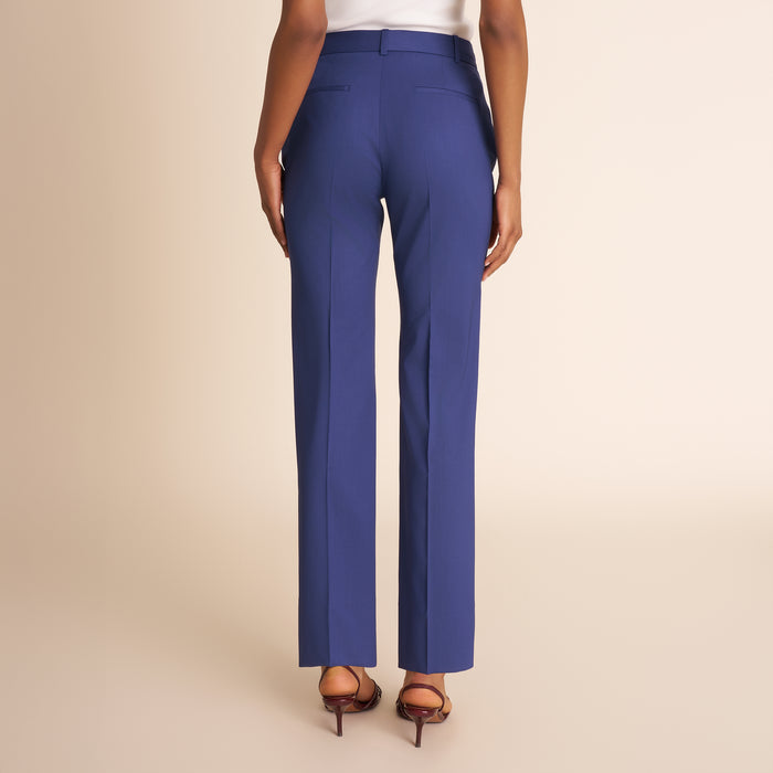 Back of woman in blue pants.