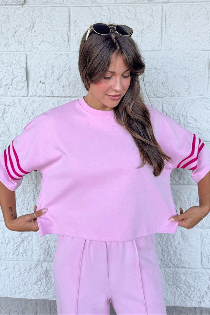 light pink with hot pink striped short sleeves crew neckline relaxed silhouette knit top