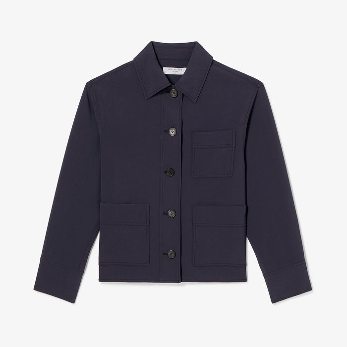 Navy jacket with button details on a light gray background
