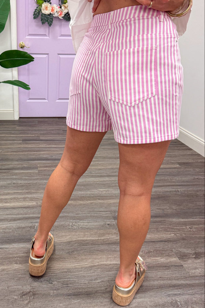 light pink and white vertical striped five pocket style lightweight twill shorts