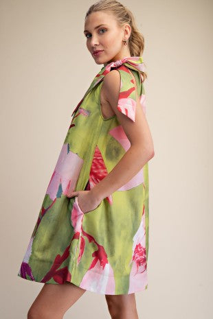 Lime and pink floral print mini dress with adjustable drawstring bow tie neck by Glam with side pockets