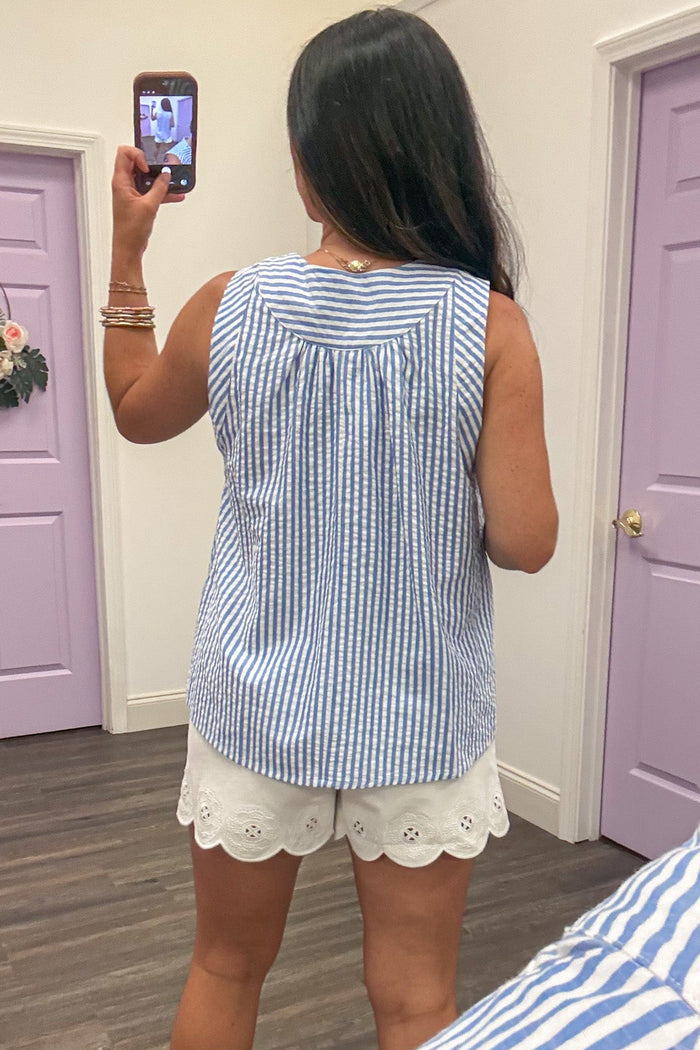 blue and white chevron striped sleeveless v neckline top with gathered detail in back