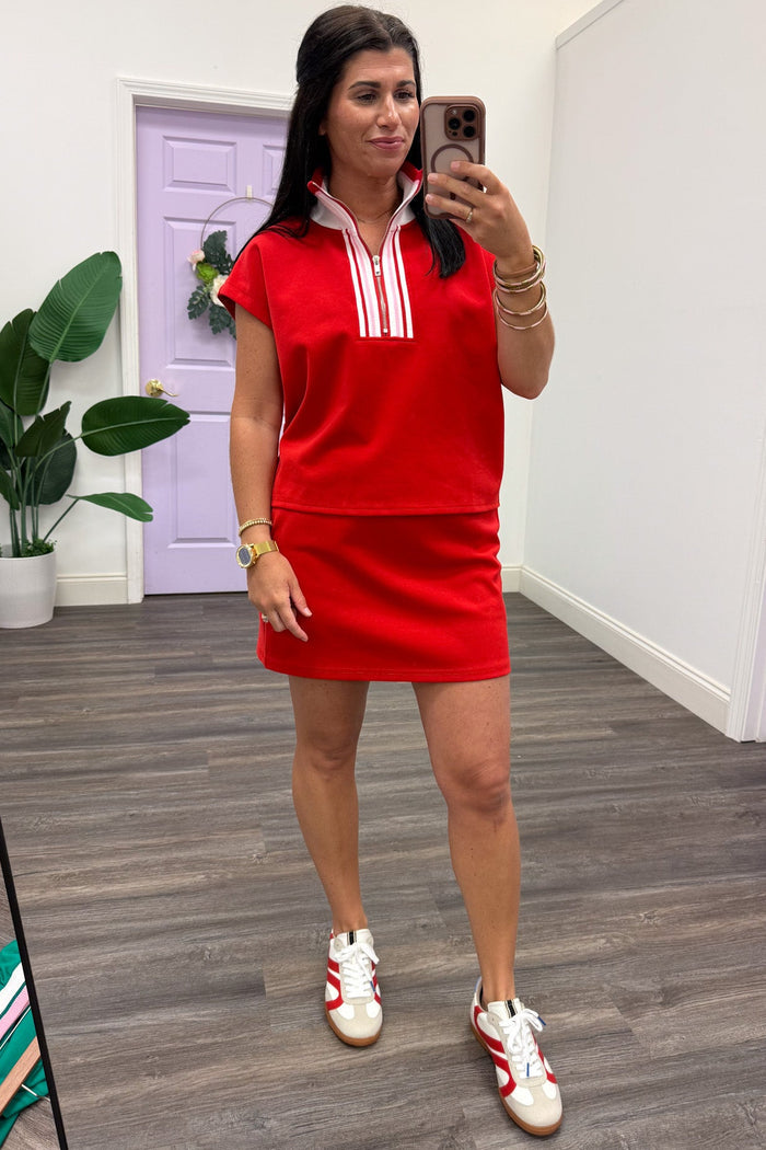 red knit active set with pink and cream striped trim detail