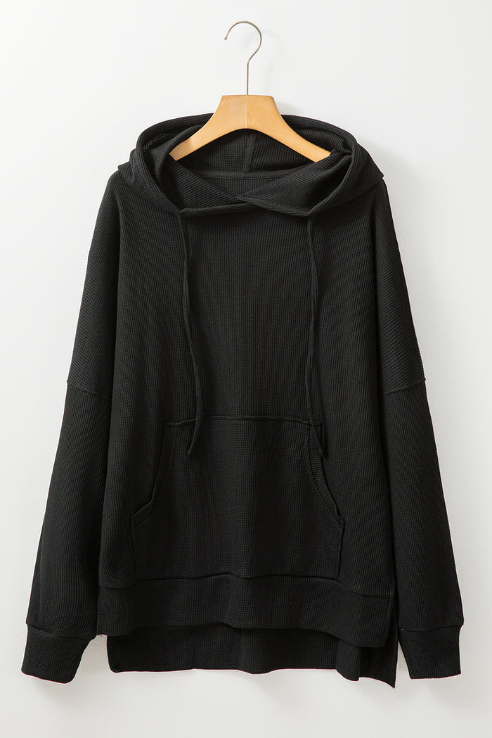Sweat à capuche surdimensionné noir en tricot gaufré doublé de polaire