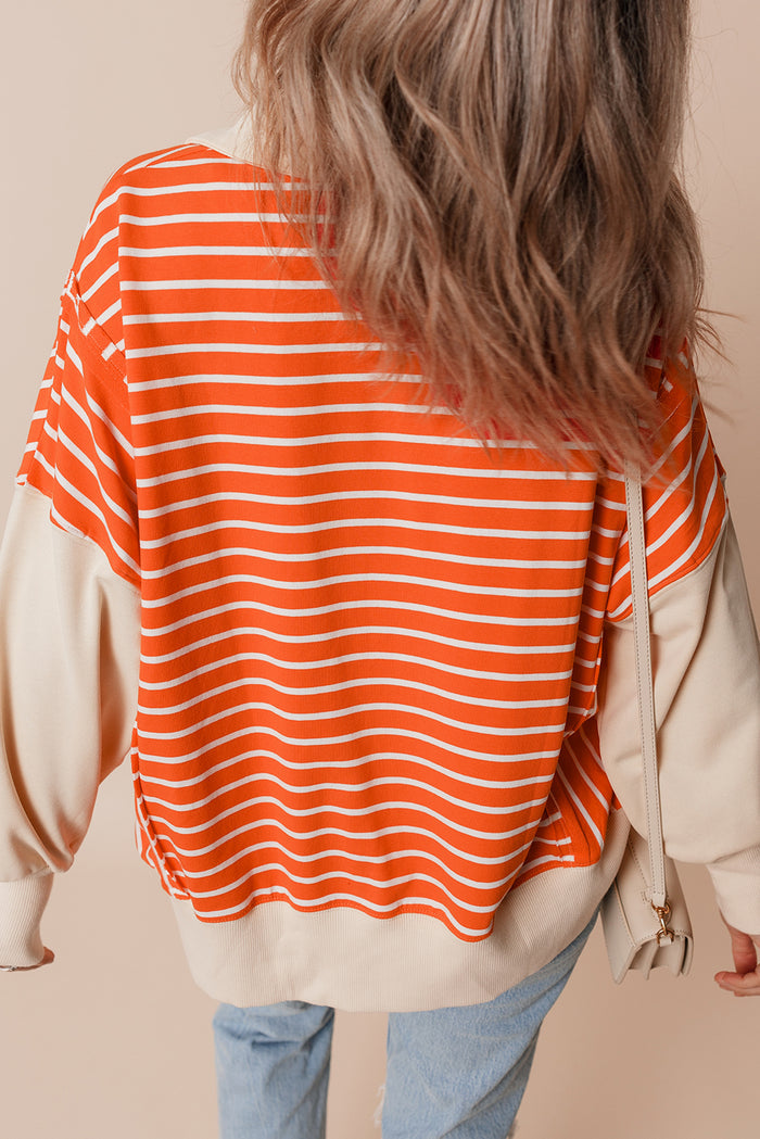 Sweat-shirt à rayures orange et blocs de couleur, coupe ample, col et épaules tombantes