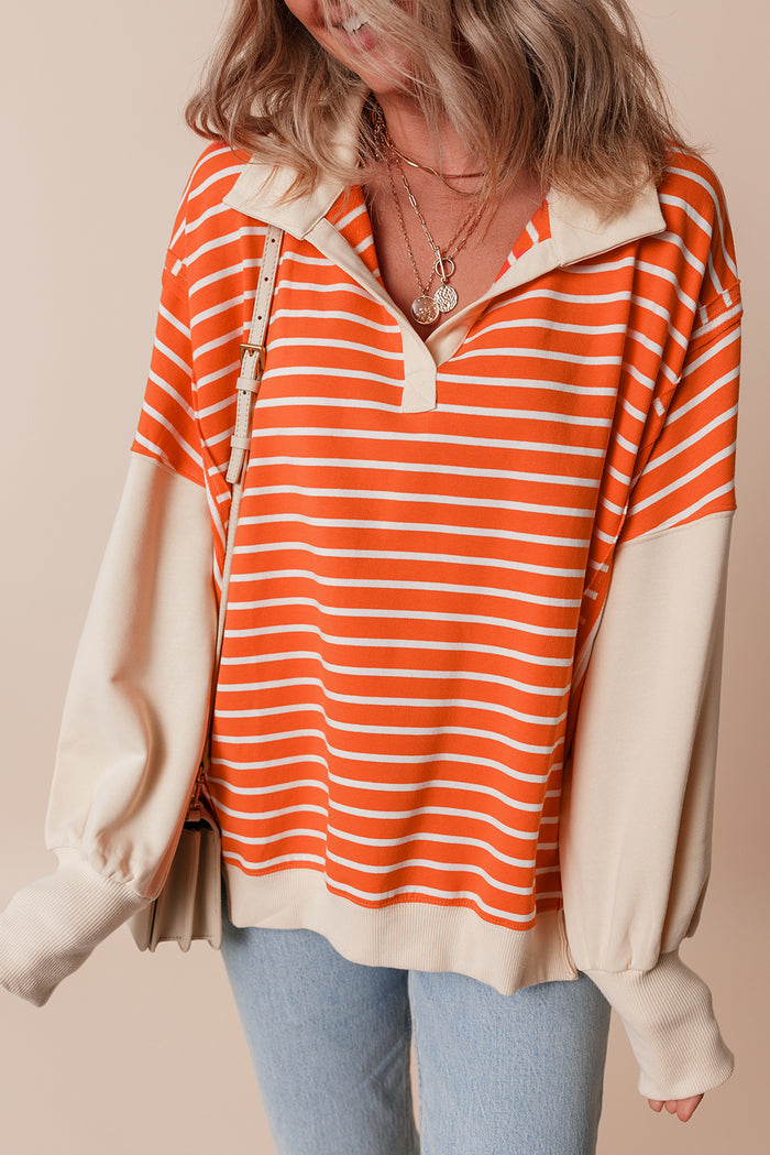 Sweat-shirt à rayures orange et blocs de couleur, coupe ample, col et épaules tombantes